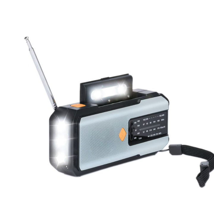 Close-up view of the portable emergency radio featuring its bright LED flashlight and radio dial interface.