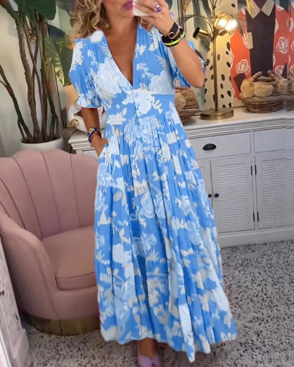 Close up of the hemline and flowy fabric of the vibrant maxi dress