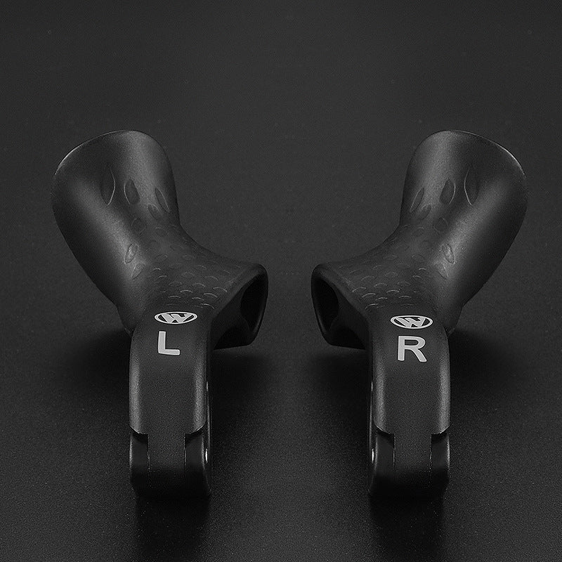 Close-up of bike ergonomic grips showing anti-slip texture and palm rest