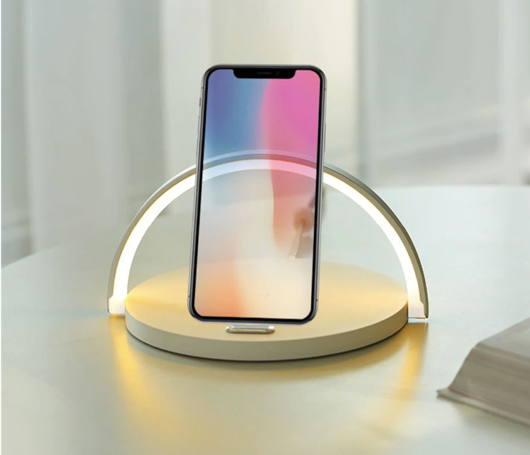Smart bedside lamp acting as a convenient phone holder while charging wirelessly