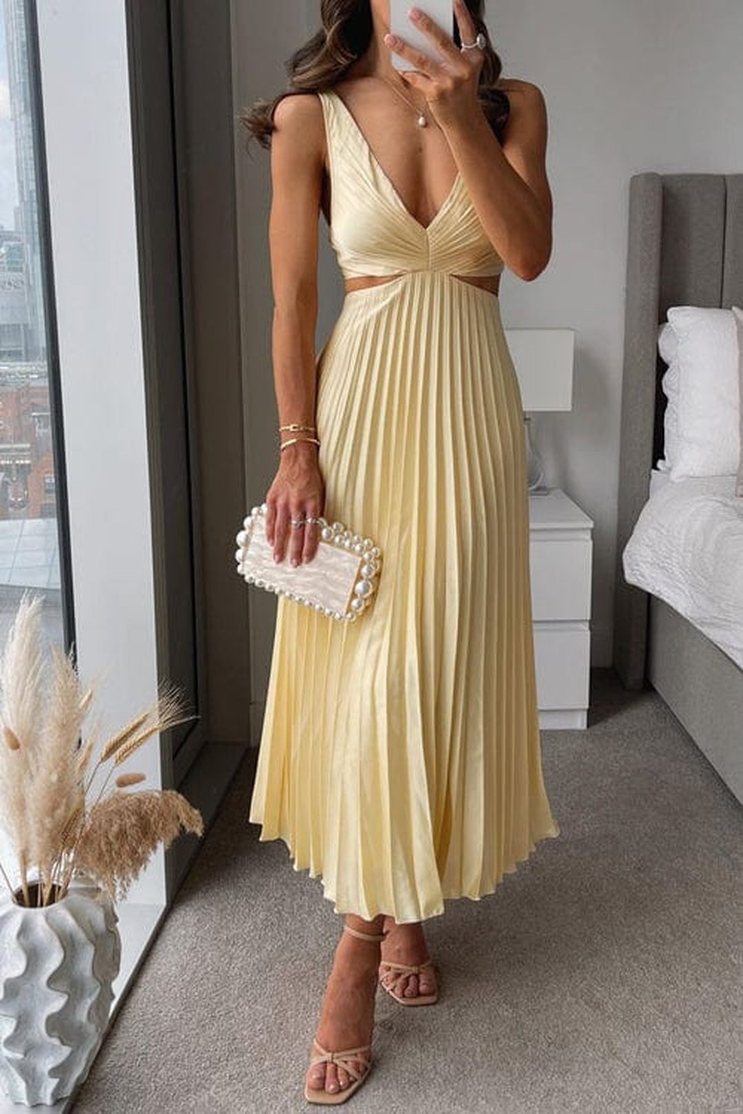 Women's elegant pleated midi dress in a sophisticated evening party style