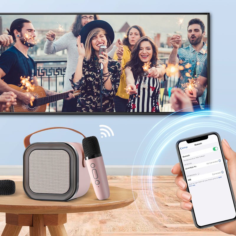 Pink portable karaoke speaker connected via Bluetooth to a smartphone