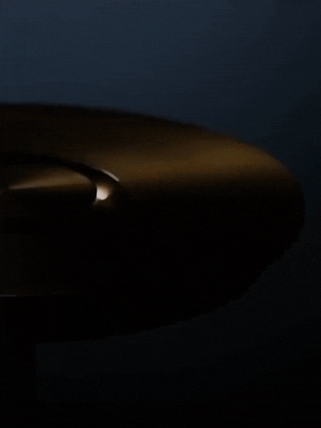 Close-up of elegant cordless LED lighting fixture emitting warm glow
