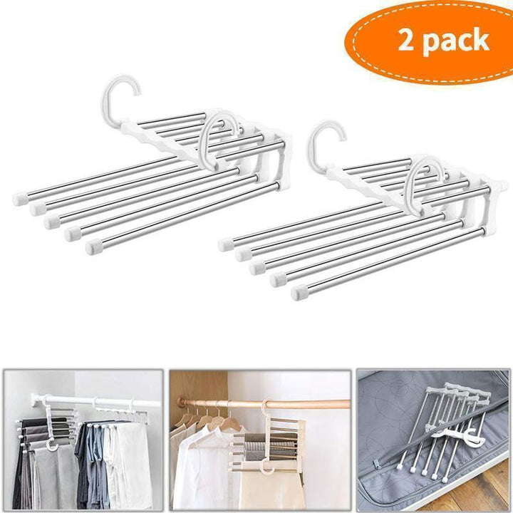 Two white magic clothes hangers shown extended and in use for organizing garments