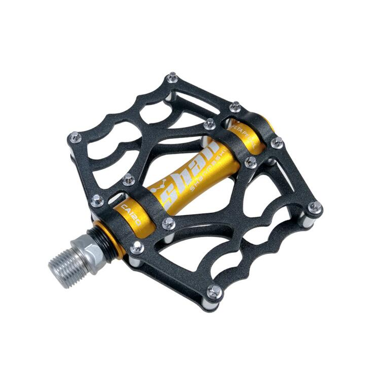 Gold and black mountain bike pedal close-up