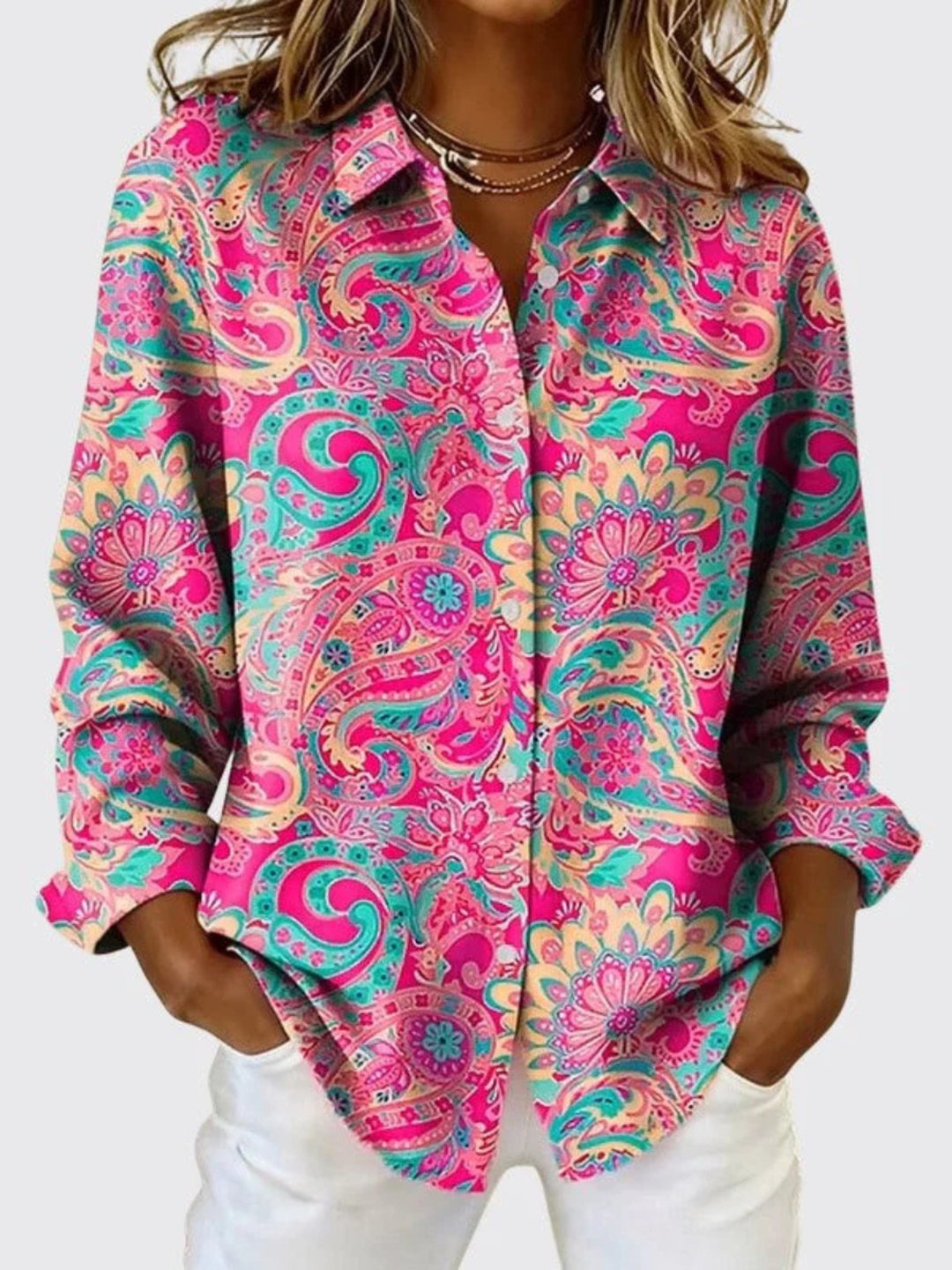 Casual women's button-down top featuring vibrant paisley pattern