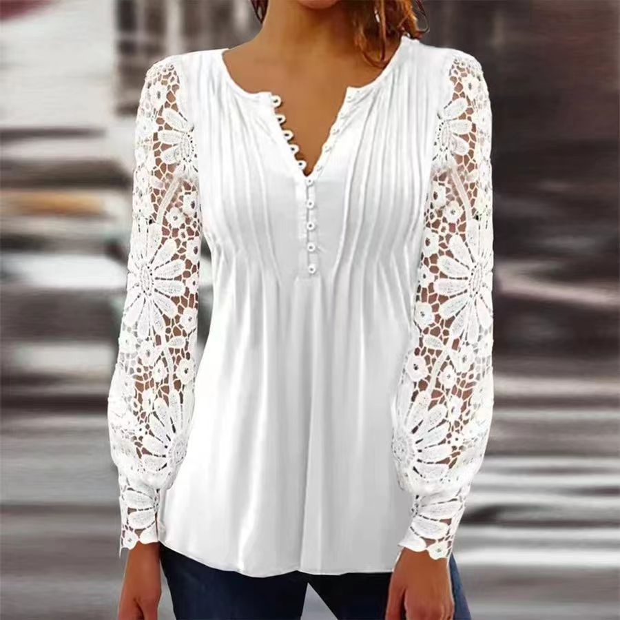 Woman wearing a white long-sleeve blouse with delicate lace sleeves