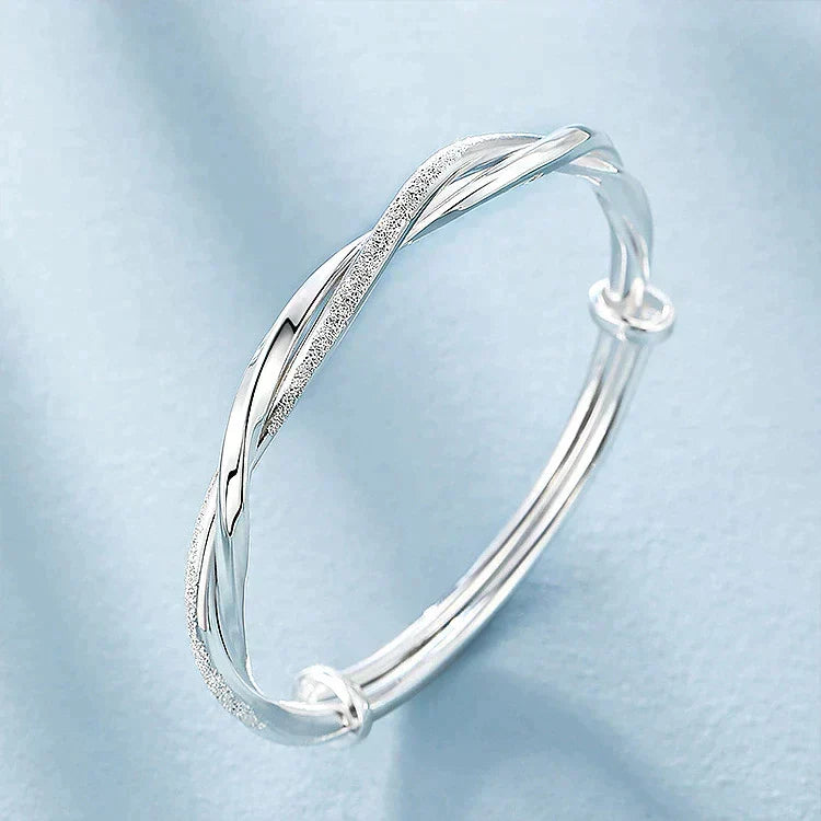 Modern handcrafted silver jewelry accessory laid flat for display