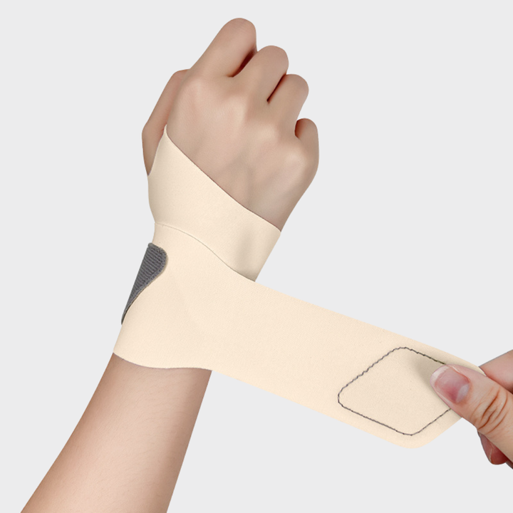 Unisex pink wrist support wrap showing adjustable strap and secure fit