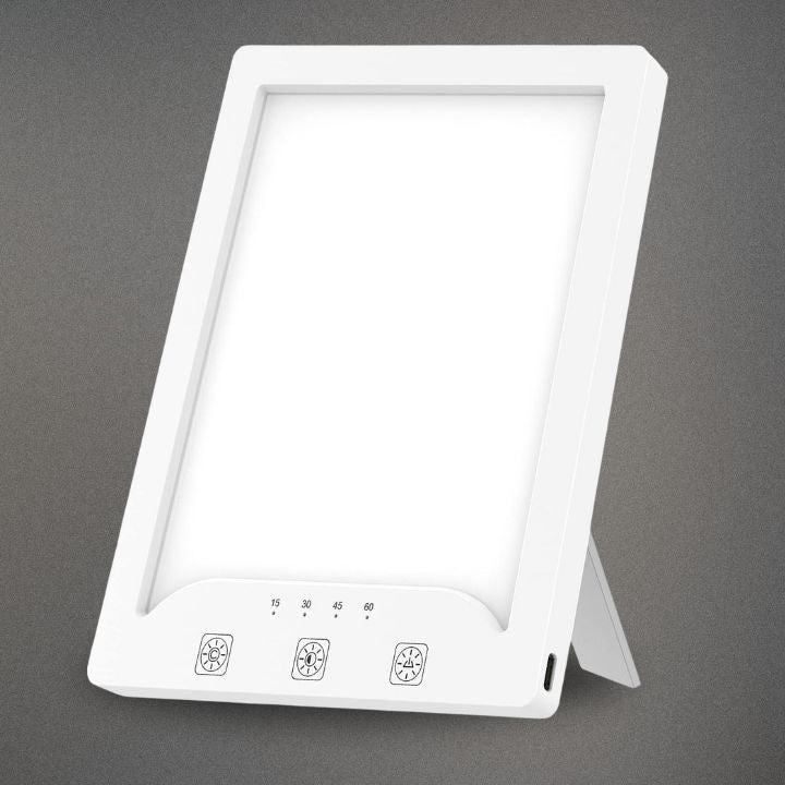 Side profile of the thin portable therapy light showcasing its sleek, travel-ready design
