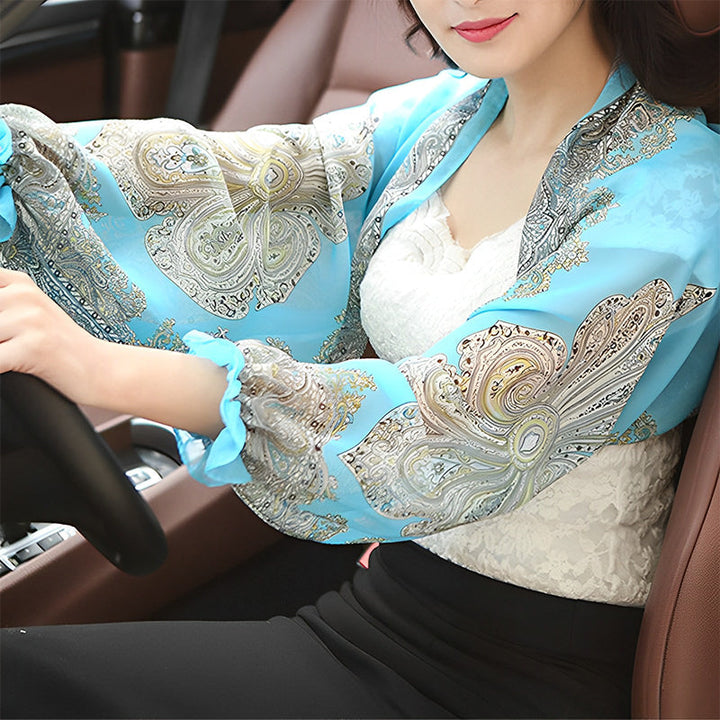Woman wearing sky blue patterned sleeve shawl with lace top