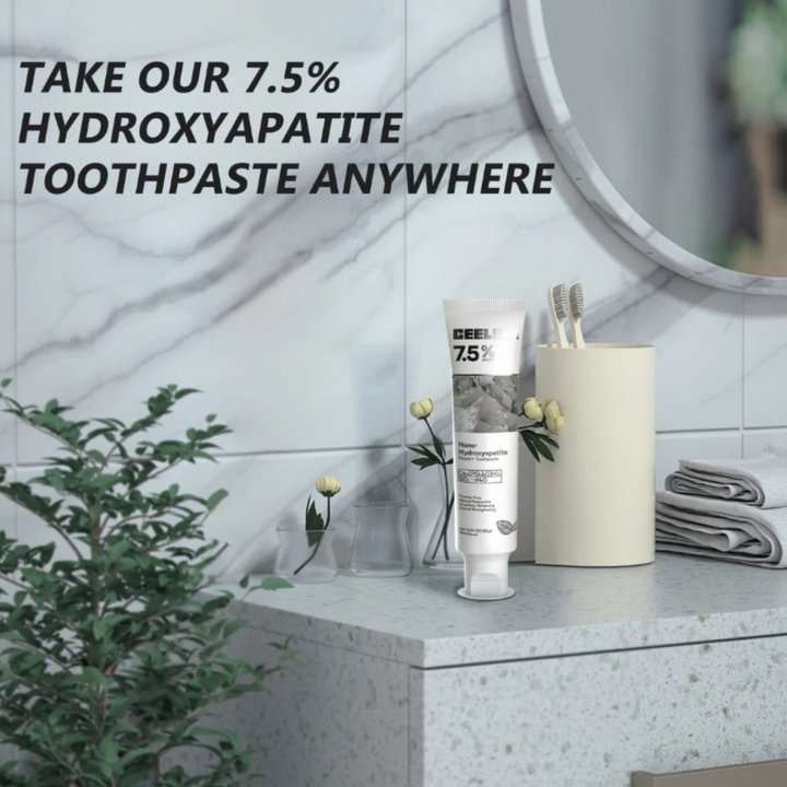 Hydroxyapatite toothpaste tube displayed on a clean marble bathroom counter