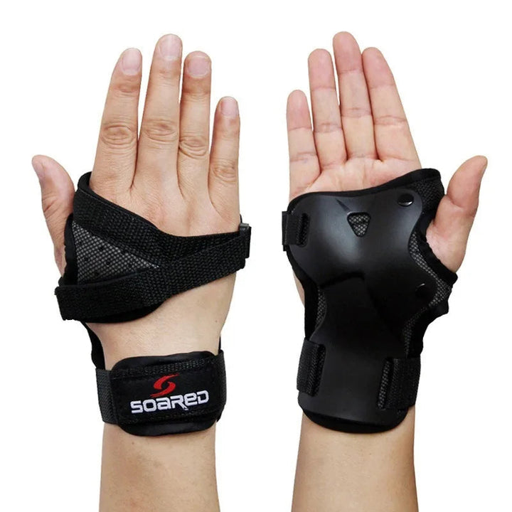 Close-up of black low-profile wrist brace worn on both hands