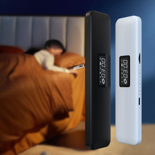 Black and white under pillow speakers displayed upright in a bedroom