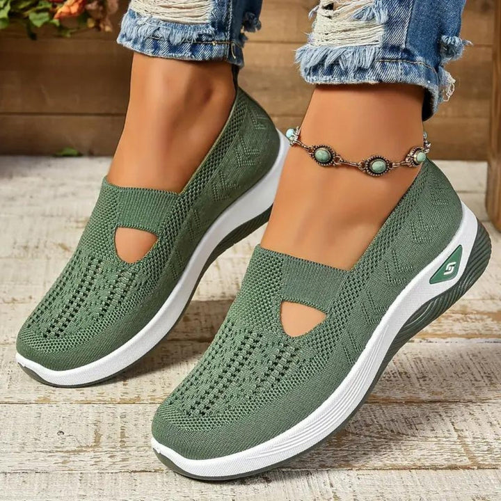 Green orthopedic walking sneakers showcasing ergonomic design