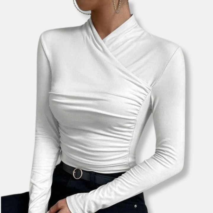 Woman wearing the white asymmetric ruched high-neck long sleeve top