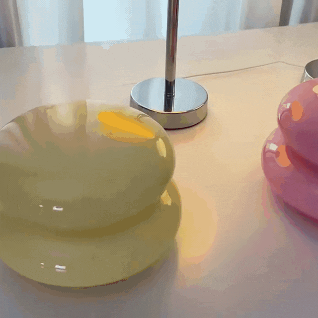 Close up of glass bedside table lamp showing sleek usb power cord