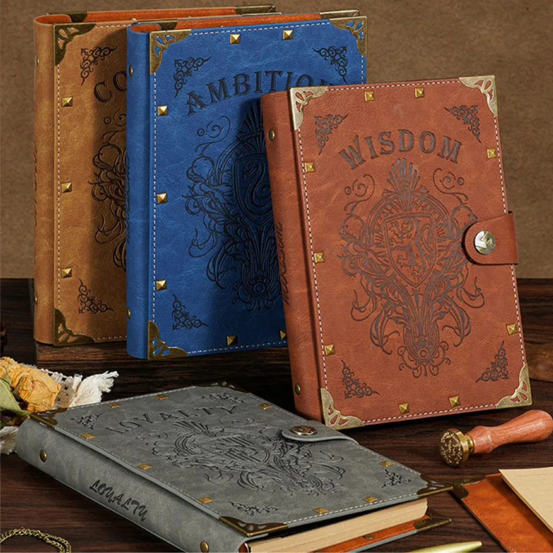 Collection of vintage embossed loose leaf notebooks in various colors and designs