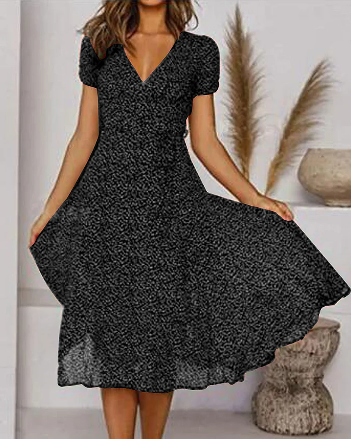 Woman wearing black V-neck puff sleeve midi dress