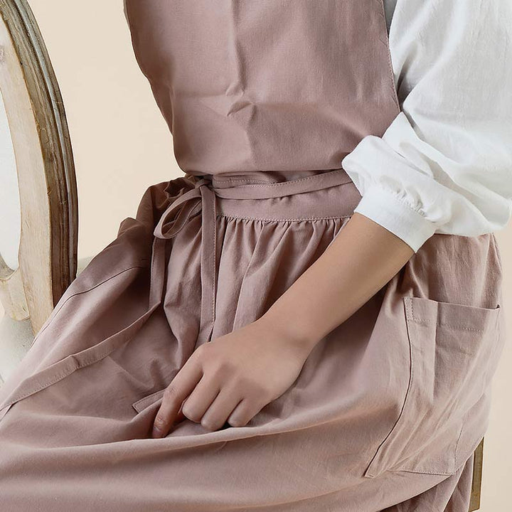 Blue chef apron made of water-resistant material with handy utility pockets