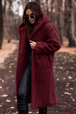Back view of hooded winter outerwear for women in classic black