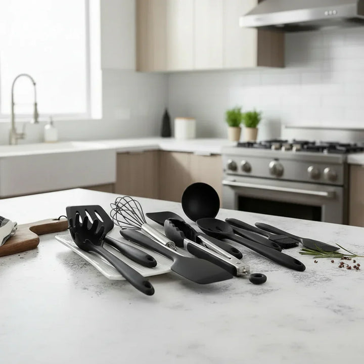 Black silicone kitchen utensil set displayed on a modern kitchen countertop