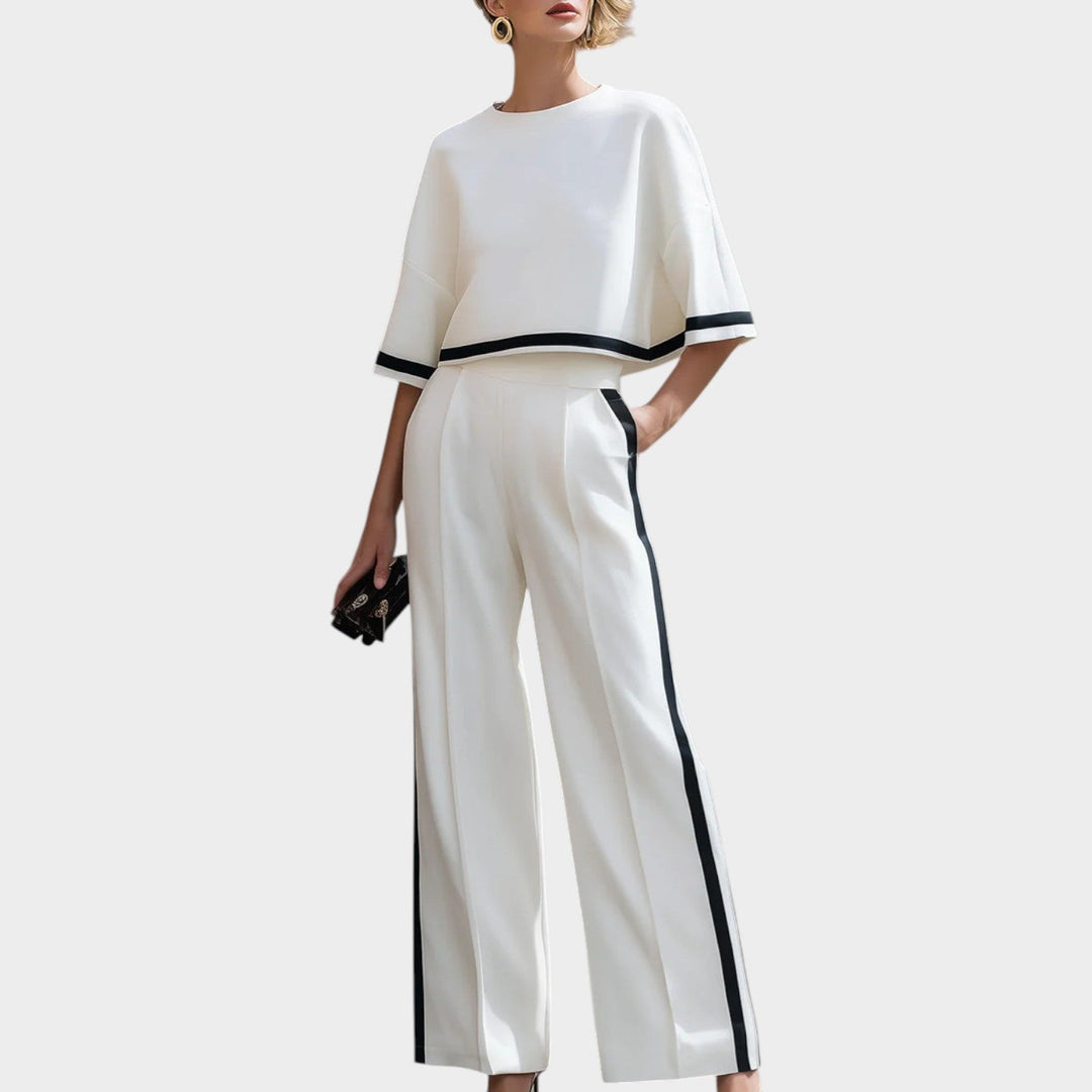 Model wearing women's white wide leg two piece matching set with contrast trim