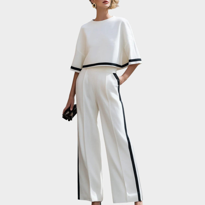 Model wearing women's white wide leg two piece matching set with contrast trim