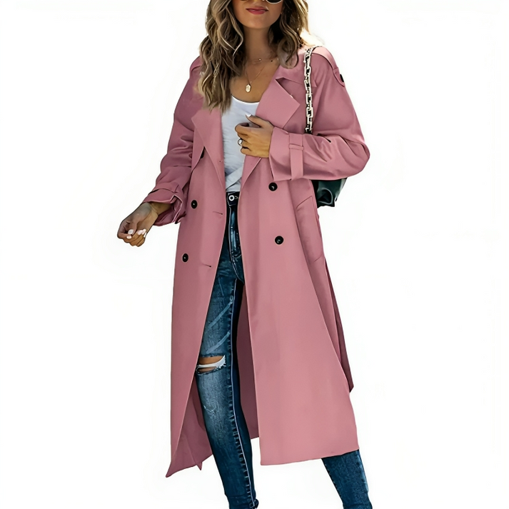 Woman wearing pink double-breasted trench coat with jeans