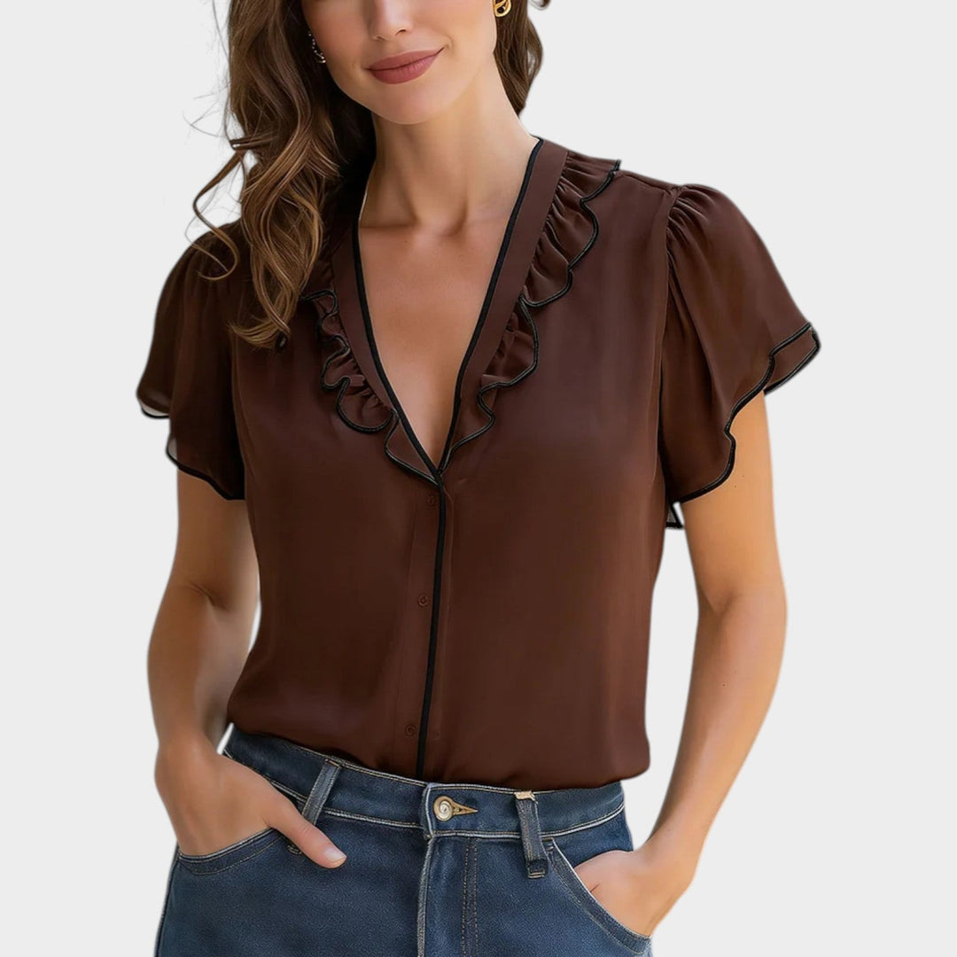 Woman wearing coffee brown ruffled V-neck short sleeve blouse