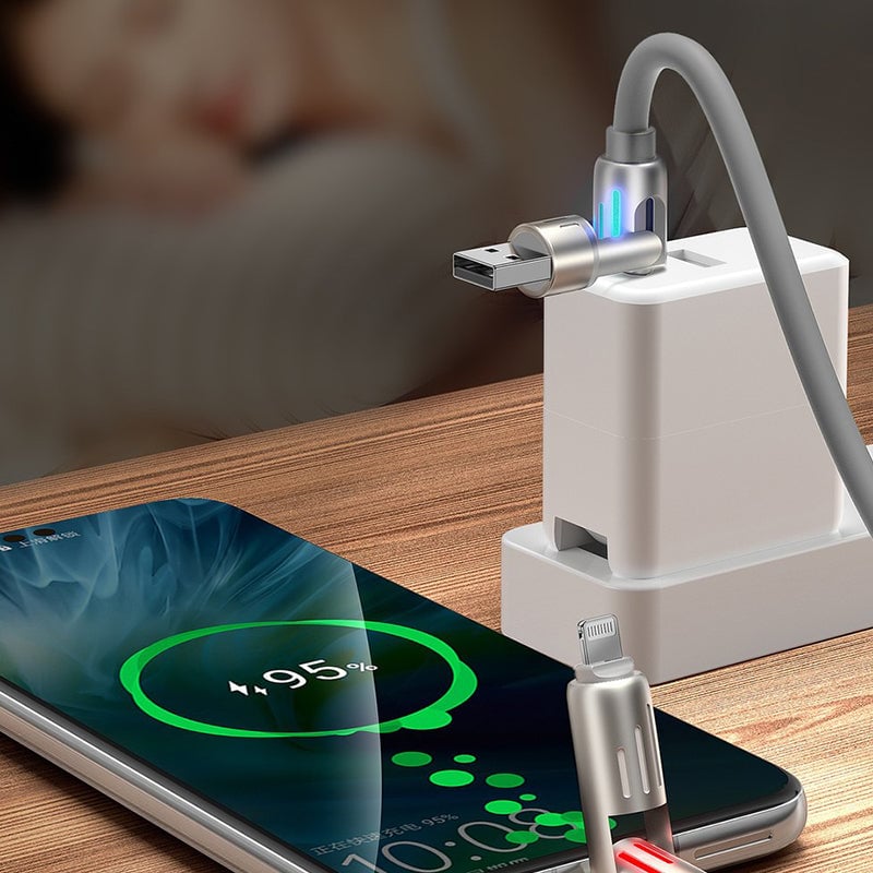Charging cable plugged into a power adapter while powering a smartphone