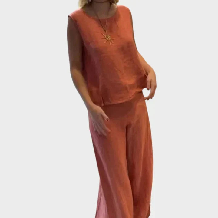 Woman wearing orange bohemian sleeveless top and cropped pants set