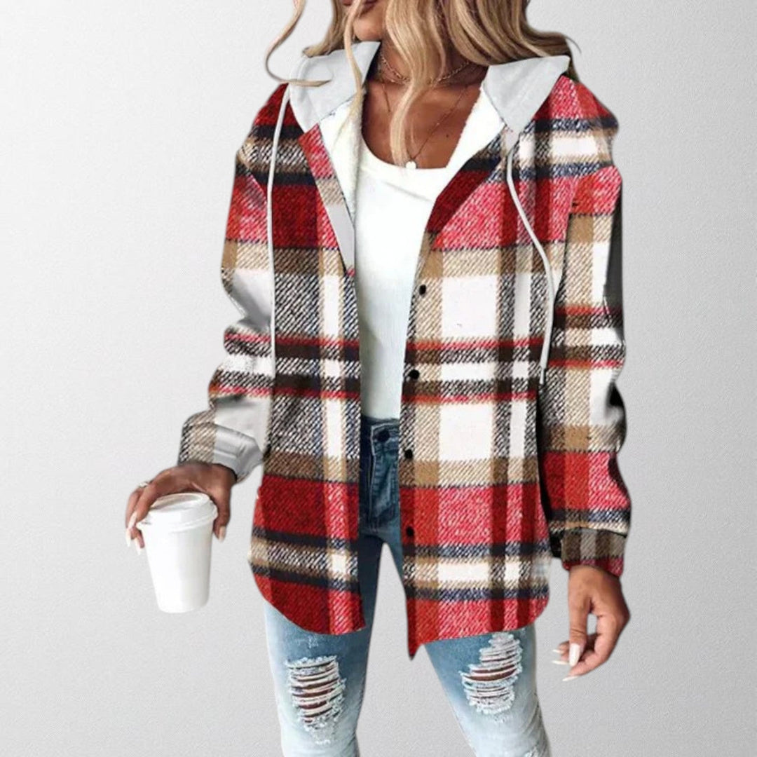 Woman wearing a red plaid hooded jacket with long sleeves and front buttons
