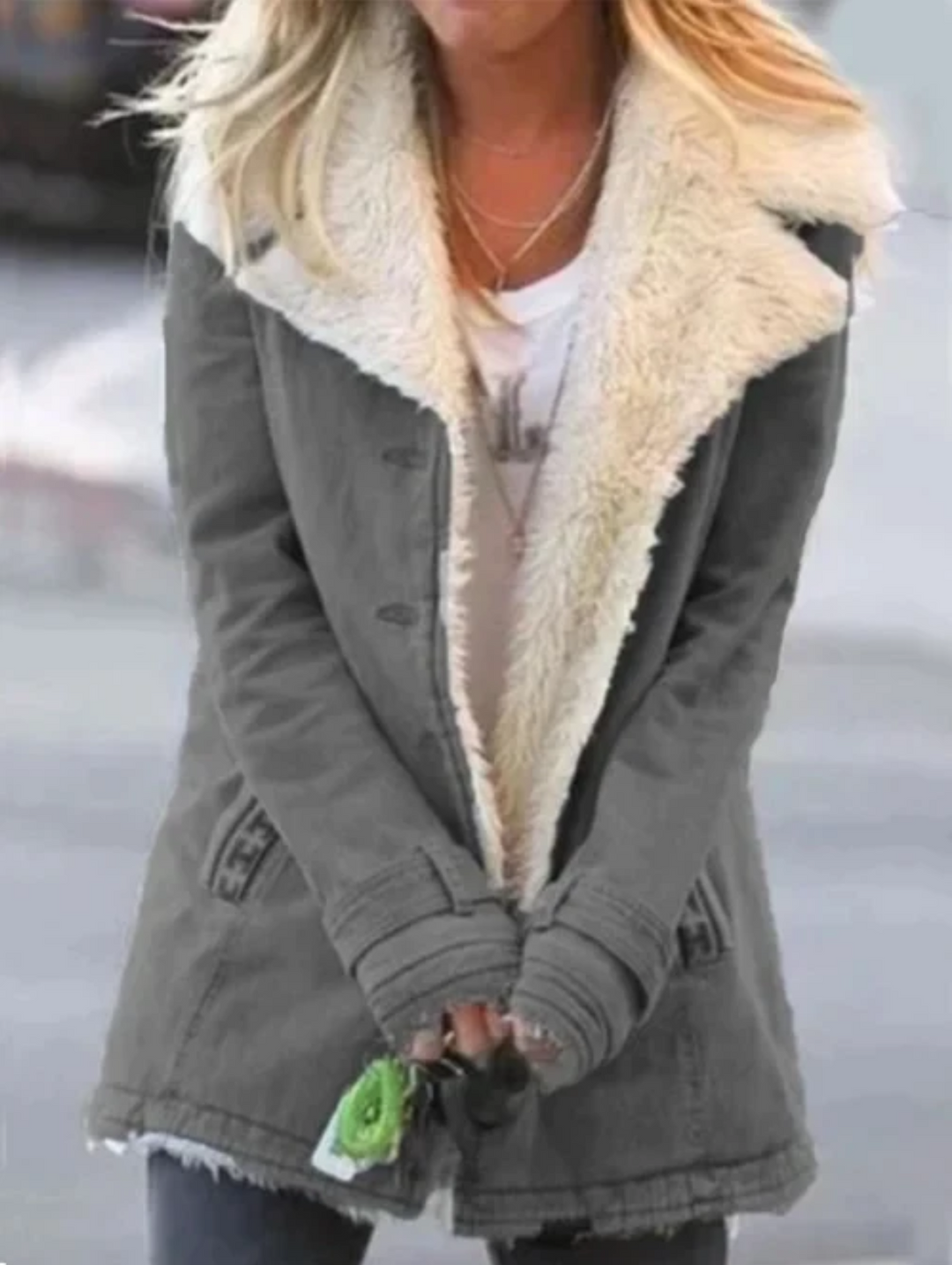 Detail of zipper and collar on women's lightweight winter fashion outerwear
