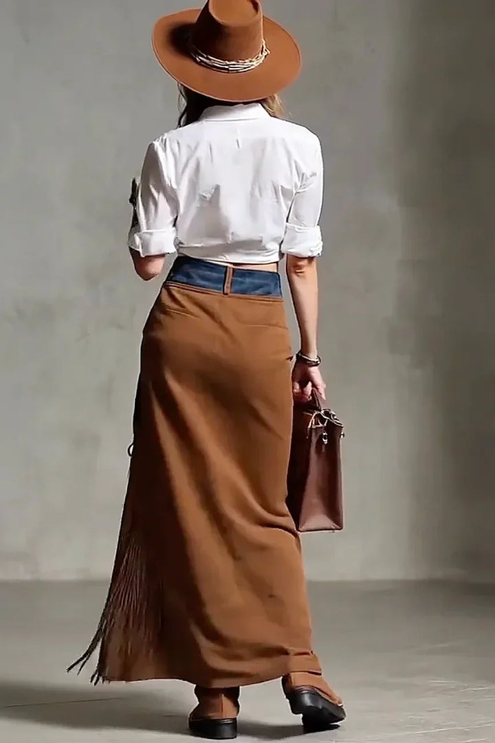 Boho fringe maxi skirt in rich brown, styled as a festival outfit for women.