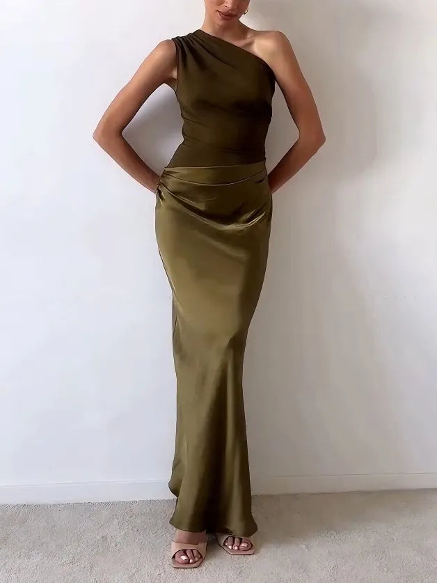 Model walking in stylish one-shoulder pleated party dress for women
