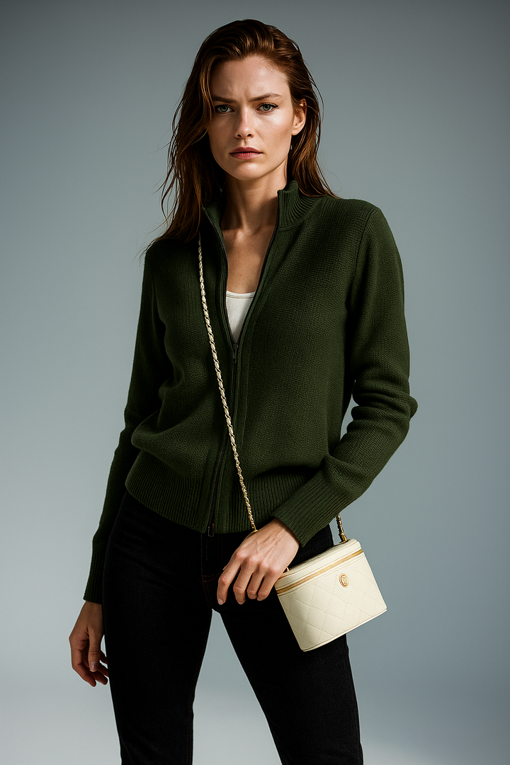 Detailed shot of metal zipper pull on womens knit cardigan