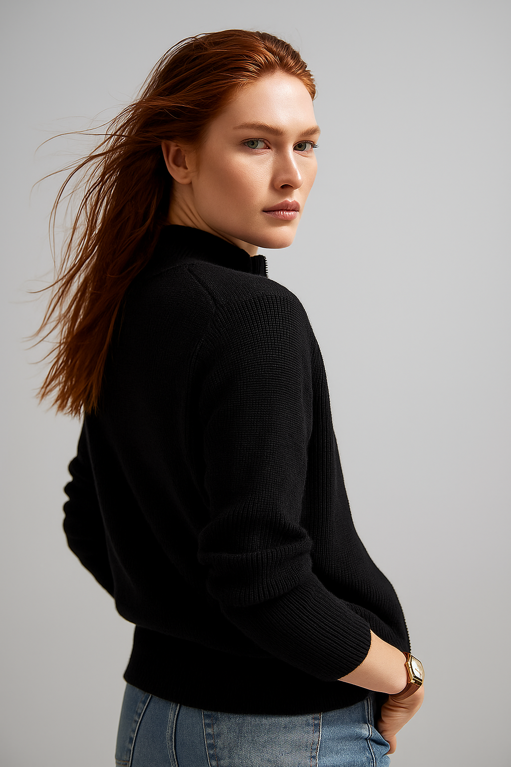 Womens knitwear sweater featuring a high collar and zipper