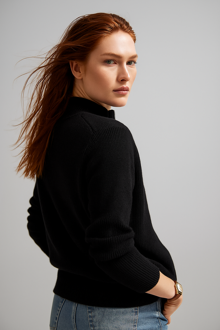 Womens knitwear sweater featuring a high collar and zipper