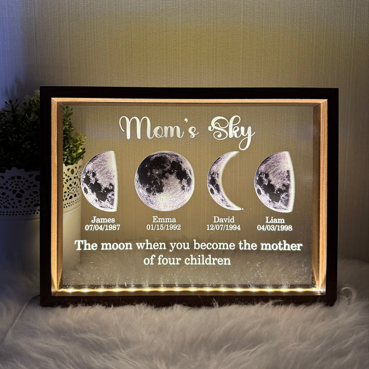 Custom illuminated moon phase display showing family dates and names