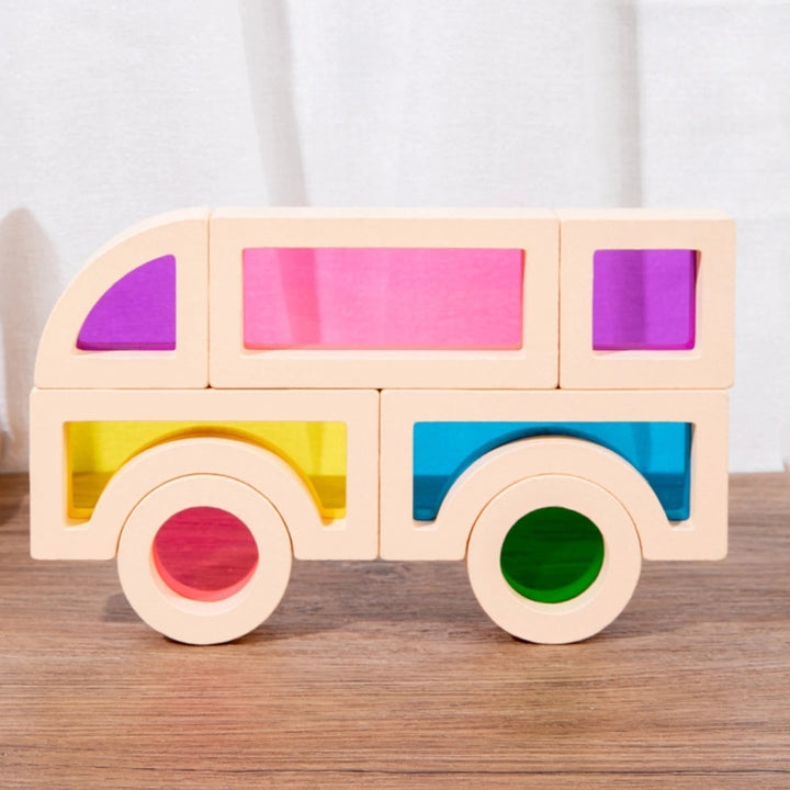 Kids' colourful wooden building blocks set laid out in various shapes