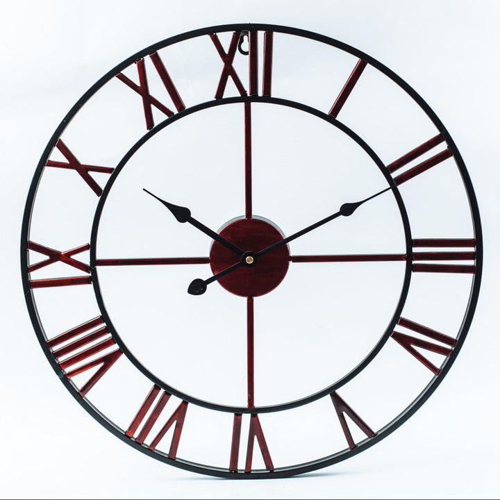 Close-up detail of metal wall art clock featuring vintage distressed numbers