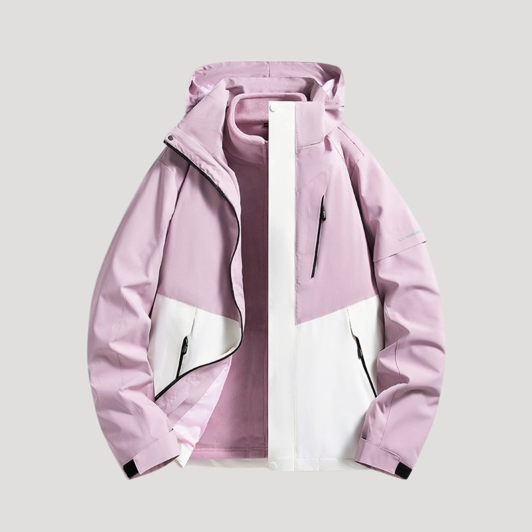 Model wearing womens outerwear rain jacket in outdoor hiking setting