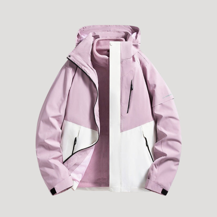 Model wearing womens outerwear rain jacket in outdoor hiking setting