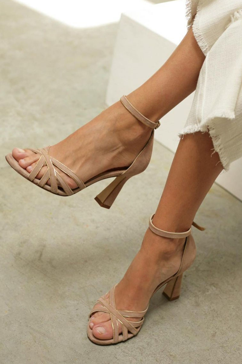 Model wearing brown patchwork peep toe heels with ankle strap