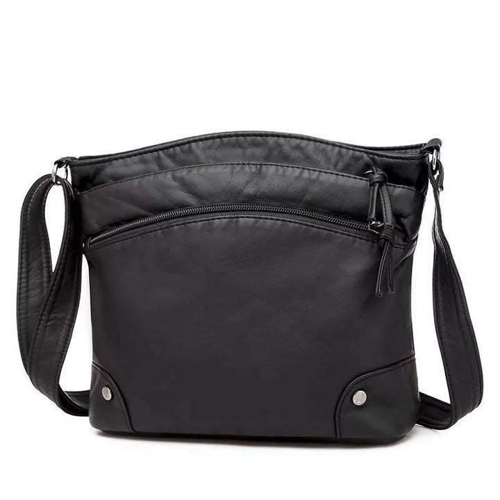 Black Zoe shoulder bag shown against a white background