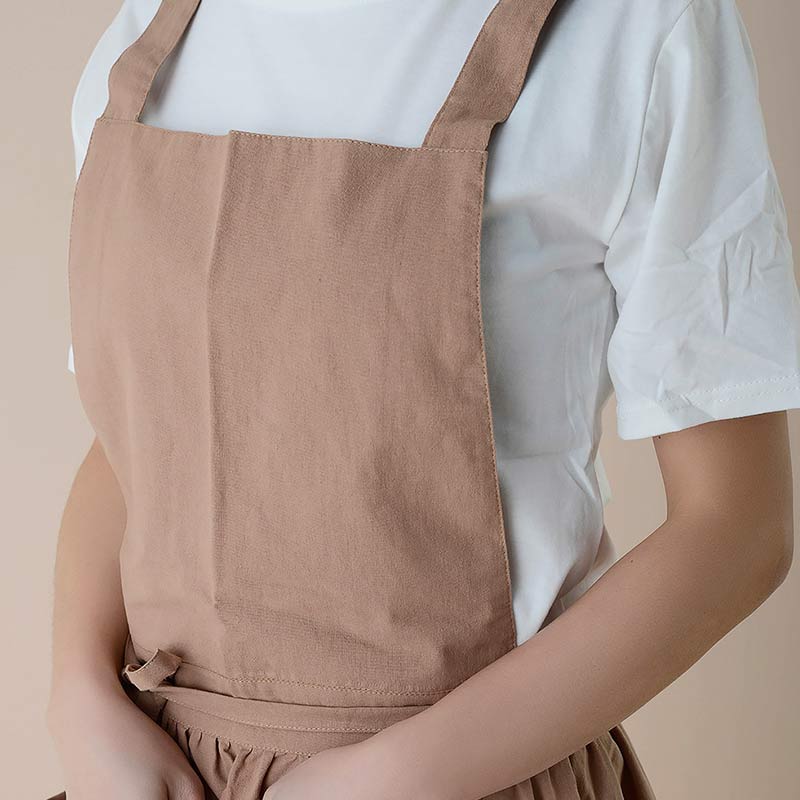 Water-repellent performance test on a blue chef baking apron