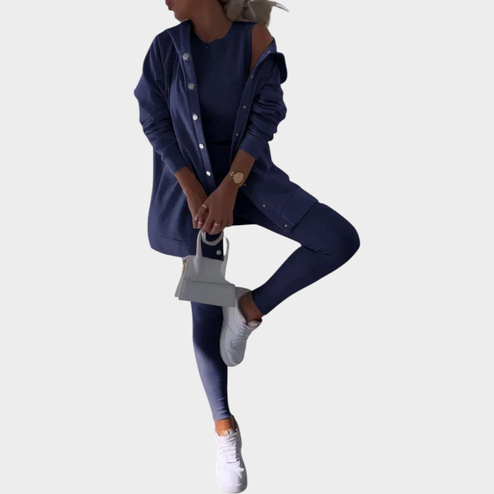 Flat lay of womens three piece lounge set including crop top, leggings, and cardigan