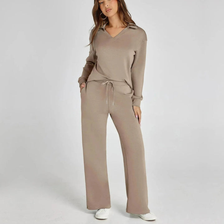 Model wearing brown women's V-neck loungewear set with wide trousers