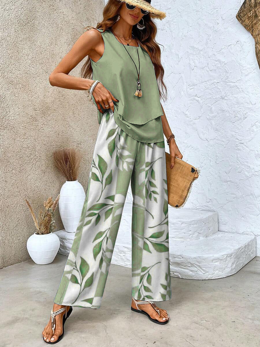 Side view of women's elegant leaf print two-piece outfit with wide leg pants